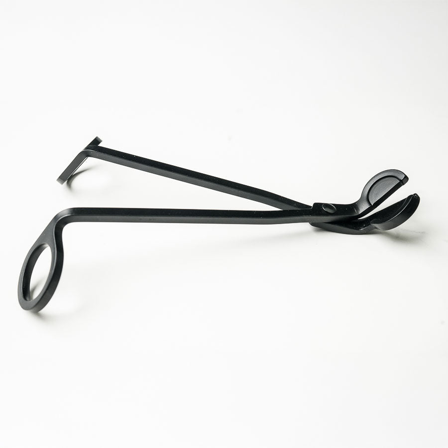 Black metal Wood Wick Scissors tool on a white background