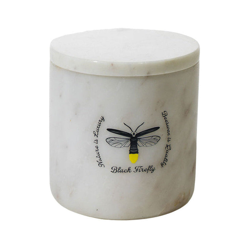 Snow of Lesotho White marble jar with black firefly design and text on a white background
