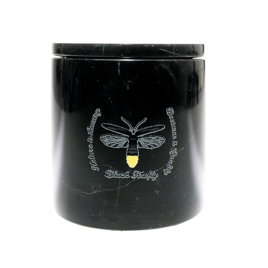 Clary Sage & Copaiba Oleoresin-Black marble candle jar with engraved bee design on a white background