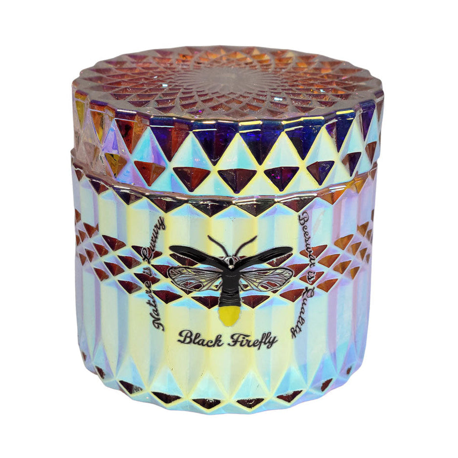 The Northern Lights - Glass Jar Candle with geometric pattern and black firefly design on a white background