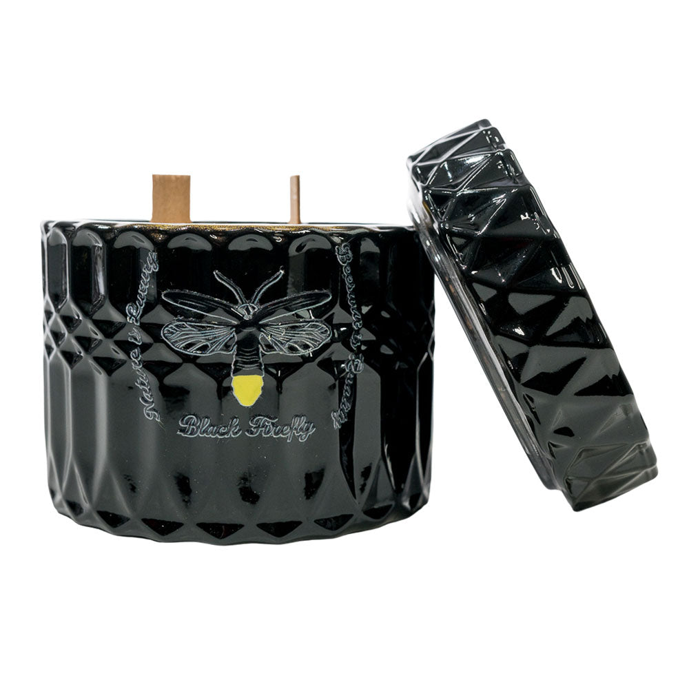 Black Hills of Panajachel - Glass Jar Candle textured candle with bee design and matching lid on a white background